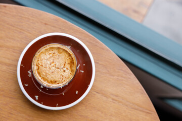 Cup of milk dirty coffee on table