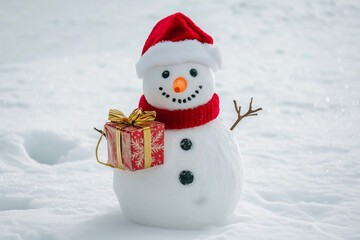 Obraz premium Snowman Holding Christmas Lantern and Gift in a Snowy Winter Landscape for a Festive Holiday Scene