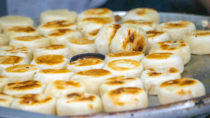 Bakpia on the pan. The chef cooks bakpia for customers. Bakpia is a typical food of Jogja (Indonesia)