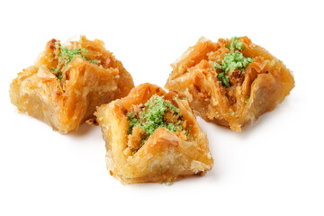 Deliciously prepared baklava with vibrant green garnish presented on a clean white surface