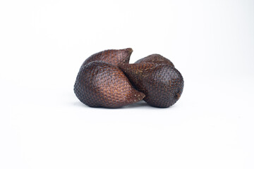 Group of salak or snake fruits with distinct brown scaly skin, isolated on white background