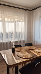 thermos mug with hot tea on wooden table, steam from hot water