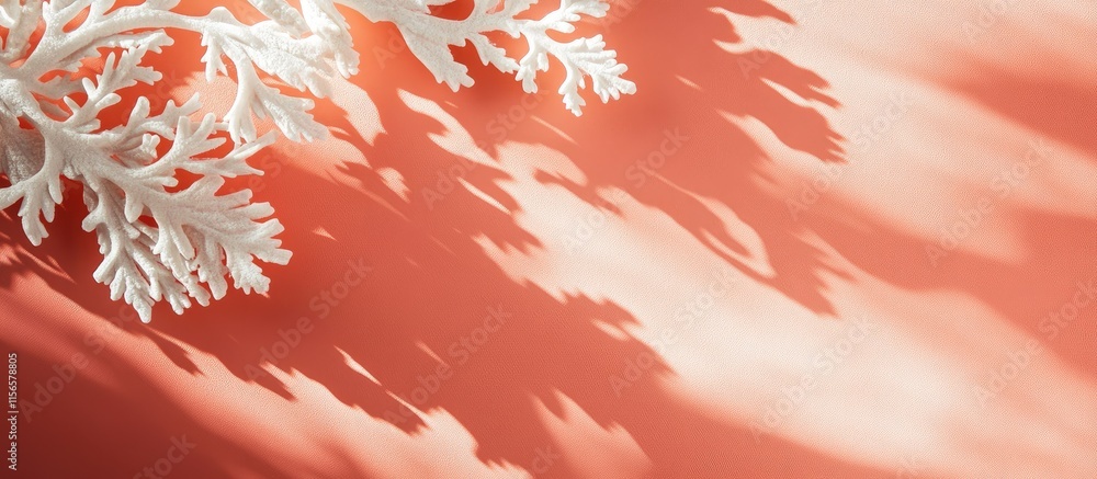 Poster coral color background with natural shadows and copy space for text featuring decorative objects in 