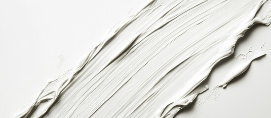 White facial peeling mud texture with fine brush strokes on a white background ideal for skincare treatment and blank space for text insertion