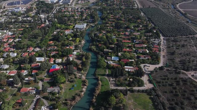 Aerial view over Kibbutz Nir David with Asi river
Drone view from Israel, 2024
