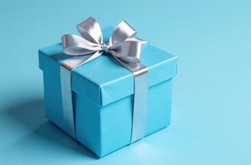 Blue gift box with silver ribbon on blue background