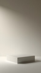 A square podium with a smooth matte finish, placed on a soft gray backdrop for an elegant and clean display