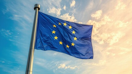 European Union Flag Waving Against Clear Blue Sky Background