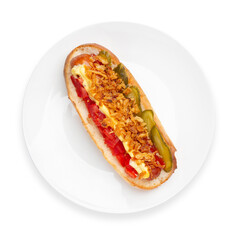 Hot dog with fried onion, tomato and cucumber, on a white background, isolated. Top view.