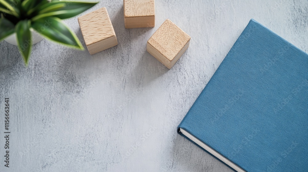 Aufkleber blue notebook beside wooden blocks labeled key performance indicator on a light gray background with