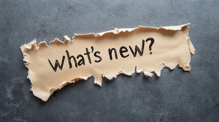 torn paper background with handwritten phrase whats new message for announcements or updates in a creative and engaging way