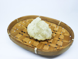 Cireng, a traditional Indonesian snack, served on a bamboo plate against a white background. 