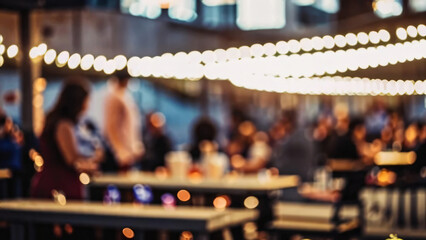 A blurred background of an outdoor cafe with people sitting at tables