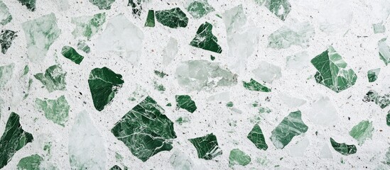 Green and white terrazzo wall texture featuring rough stone design ideal for home interior decor with ample space for text or design elements