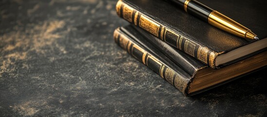 Gilded vintage books and elegant pen on dark velvet surface with ample space for personalized text or branding design