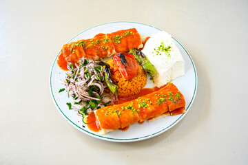 Famous Urfa meat liver, ciger wrapped by lavash with roasted chili pepper, onion and sauce in...