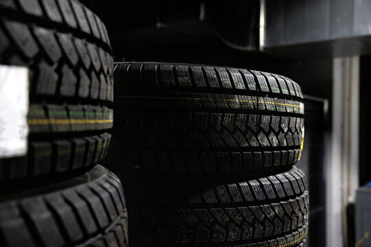 Car tires stack at warehouse. Selective focus