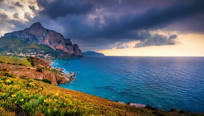 Aerial view at sunset over the Mediterranean sea. Location place Island Sicilia, Zafferano cape, Palermo city, Italy, Europe. Scenic image of famous european resort. Discover the beauty of earth.