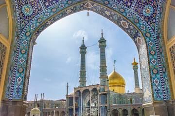 View of the Fatima Masumeh shrine through an arch decorated with Persian ornaments, Qom, Iran