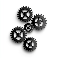 A collection of black gear wheels in various sizes, illustrating the concept of mechanics and engineering.