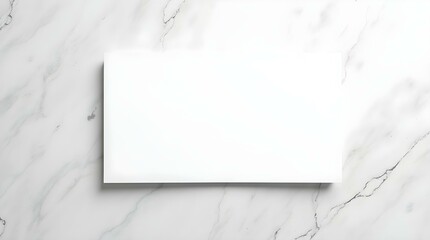 A blank white picture frame hangs on a light gray wall, ready for an image or text.
