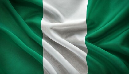 Obraz premium Nigeria national flag waving in the sky behind the tree. The flag blow in beautiful sunlight. Nigeria national flag for independence day.