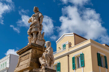 Obraz premium The monument to King Charles Emmanuel III in the square of the same name, Carloforte, Sardinia, Italy