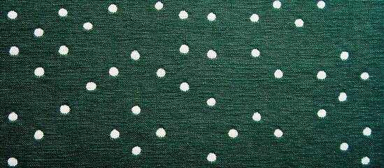Green and white dotted fabric texture wallpaper suitable for backdrop or template with ample space for text and creative design elements