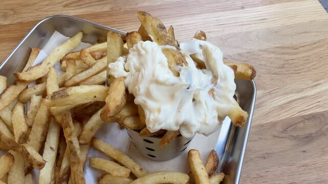 Eating french fries with mayonnaise