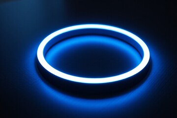 Fototapeta premium a close up of a blue neon ring on a table