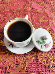 Coffee in a classic cup on the table,