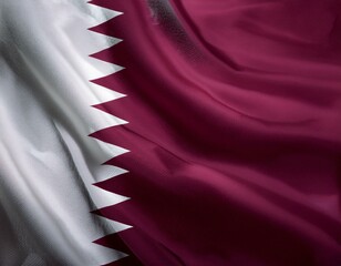 Qatar flag waving on a pole. The flag of Qatar features maroon and white colors. Qatar flag symbolizes national pride. Maroon and white flag of Qatar.