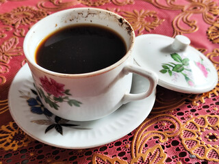 Coffee in a classic cup on the table,