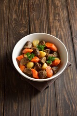 Beef meat stewed with potatoes, carrots and spices