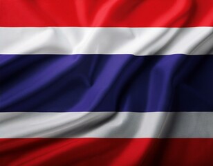 Fototapeta premium A flag of Thailand is flying in the sky. The flag is red, white, and blue