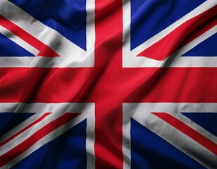 Close up full framed wave United Kingdom Union Jack fabric flag background.