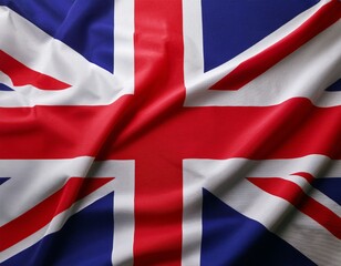 Close up full framed wave United Kingdom Union Jack fabric flag background.