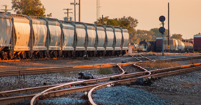 Dry bulk  train cars in railyard  in Detroit at dawn