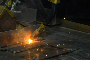 Close up scene the welding process by robotic system.