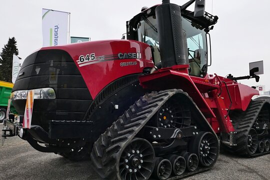 Left front view of modern massive crawler tractor Case Quadtrac 645 displayed on exterior of Agrosalon agricultural expo in Nitra, Slovakia, december 2024. 