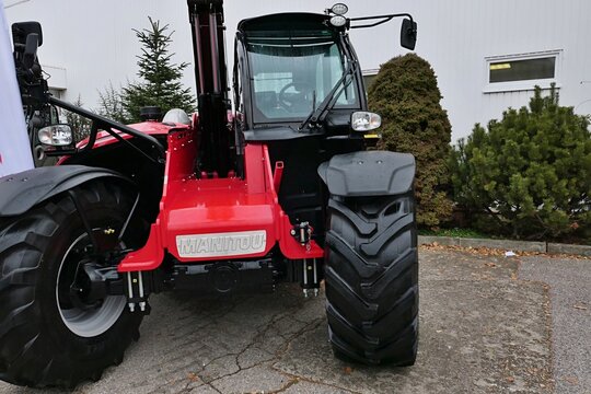 Front view of modern french telehandler Manitou, used in construction as well as in agricultural environment, displayed with raised arm on Agrosalon expo in Nitra, Slovakia, december 2024. 