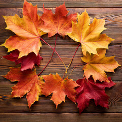 Autumn Maple Leaves on Rustic Brown Wooden Background, Generated image