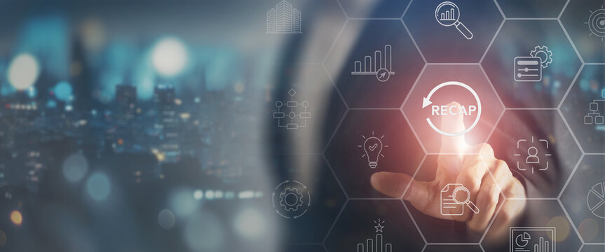 2024 Recap economy, business, financial concept. Businessman touching on RECAP text on virtual screen. Recap business, past performance for strategic planning, business improvement and development.
