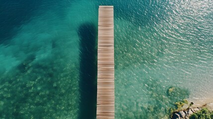 Wooden Pier Extends Over Teal Ocean Water