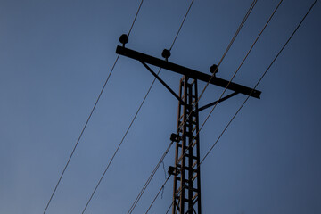 Silhouette of Utility Pole and Wires at Dusk