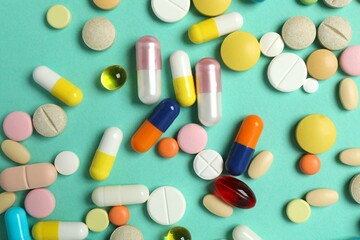 Various pills on a colored background