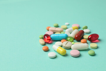 Various pills on a colored background