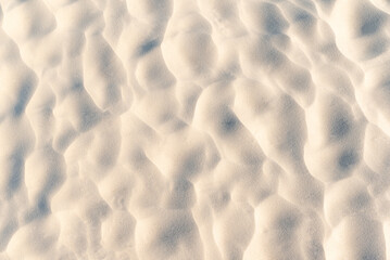Sand on beach with wavy texture. Close up of sand on the beach with beautiful texture made by wind