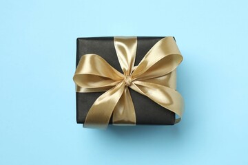 Beautiful gift box on color background