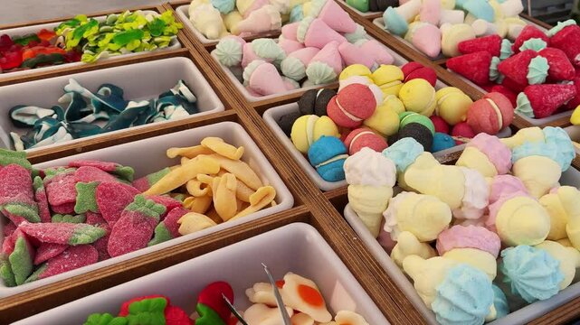 Display of sweets in the Christmas town feria in Barcelona, range of marmalade and candys. High quality 4k footage